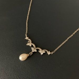 Silver necklace with accented jewels and pearl
